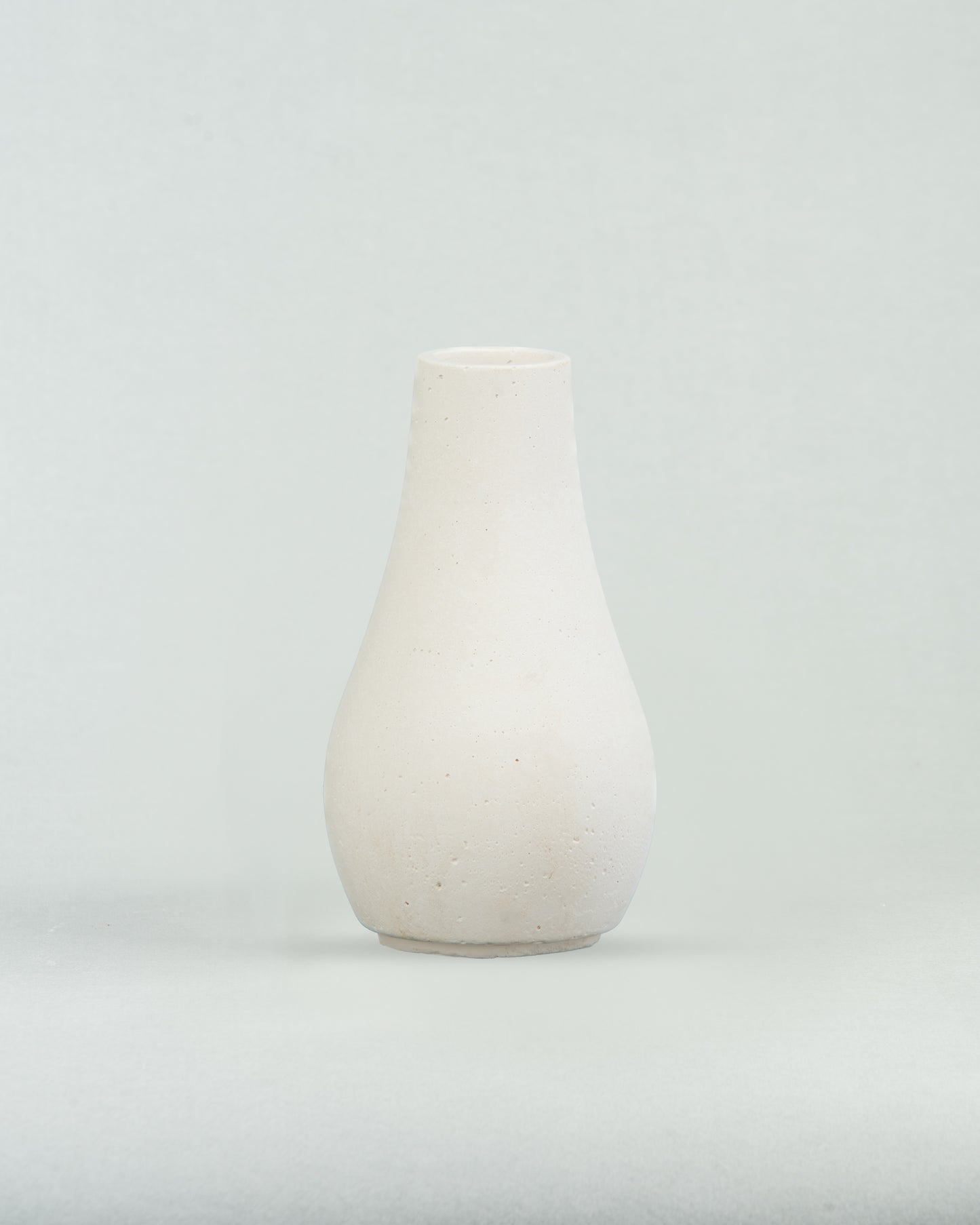 Pearlescent Charm: White Concrete Bottle in Pear Shape