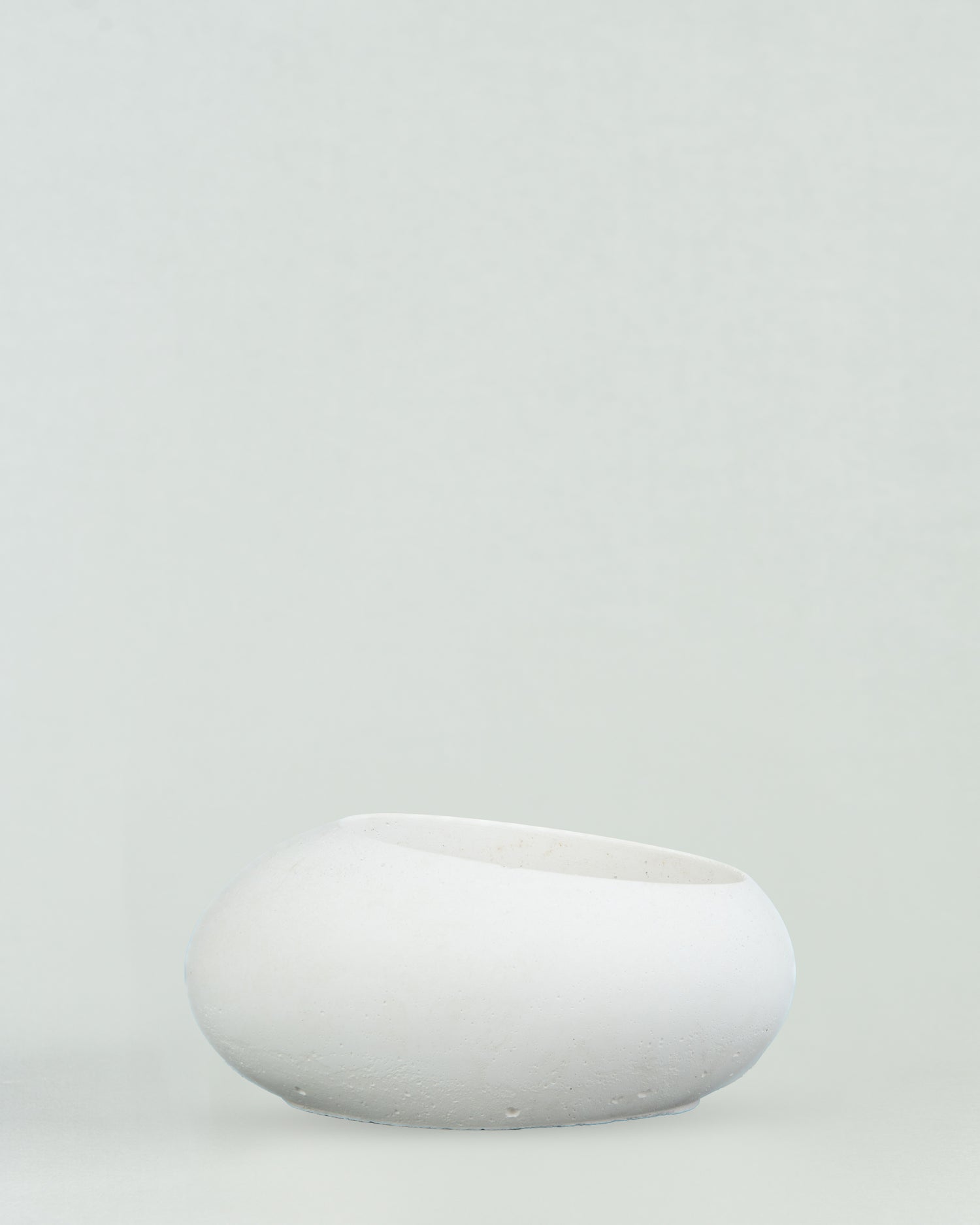 Eggquisite Charm: White Concrete Egg-Shaped Holder for Candles and Cacti