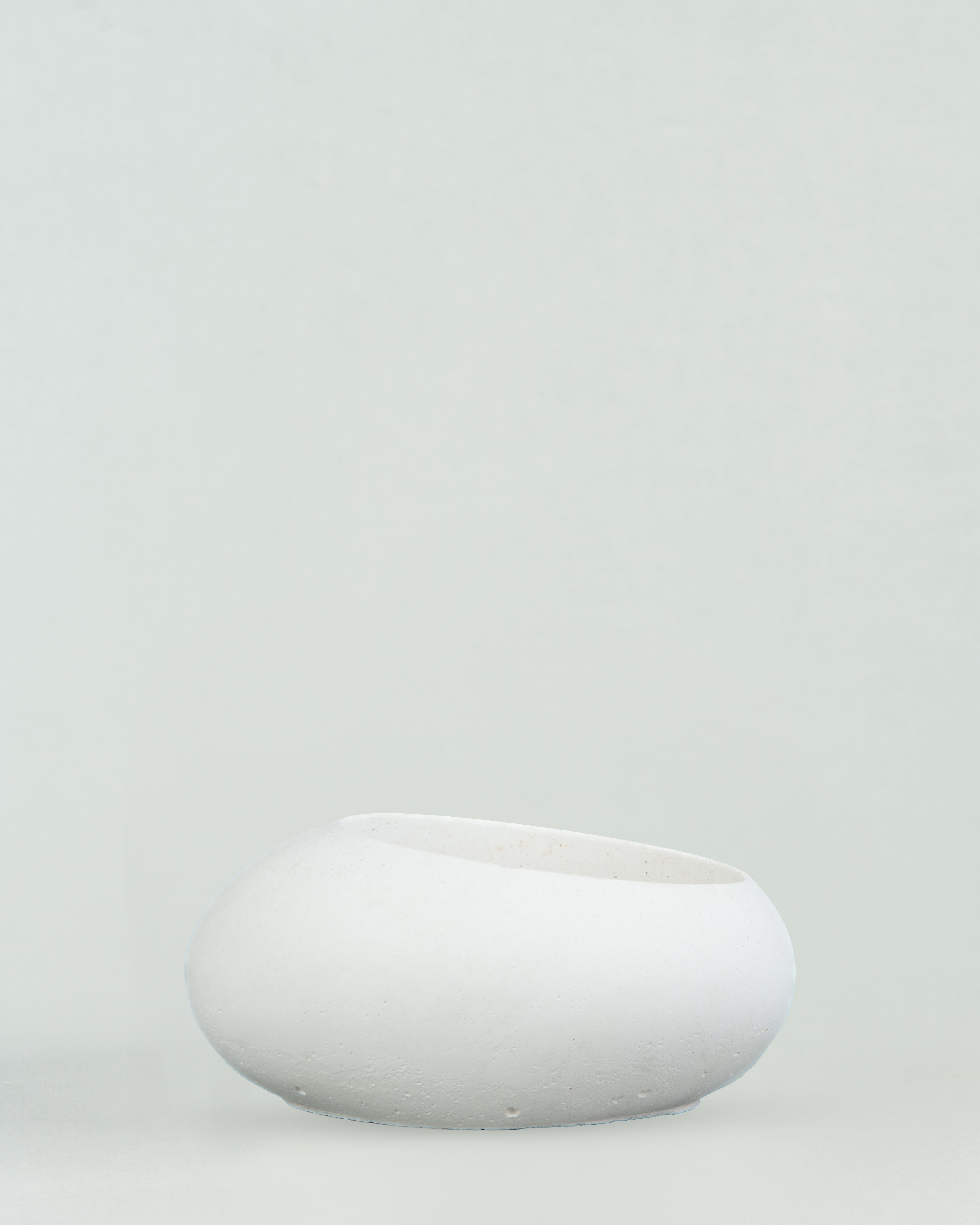 Eggquisite Charm: White Concrete Egg-Shaped Holder for Candles and Cacti