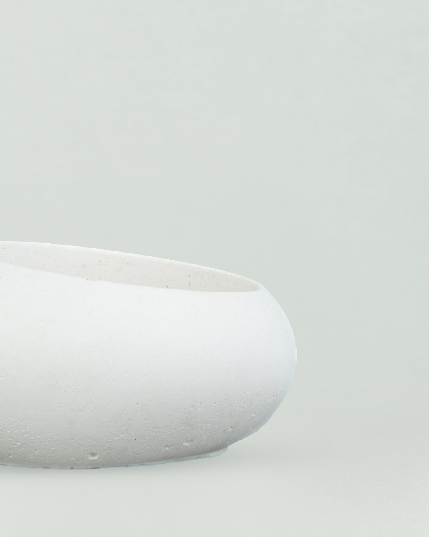 Eggquisite Charm: White Concrete Egg-Shaped Holder for Candles and Cacti