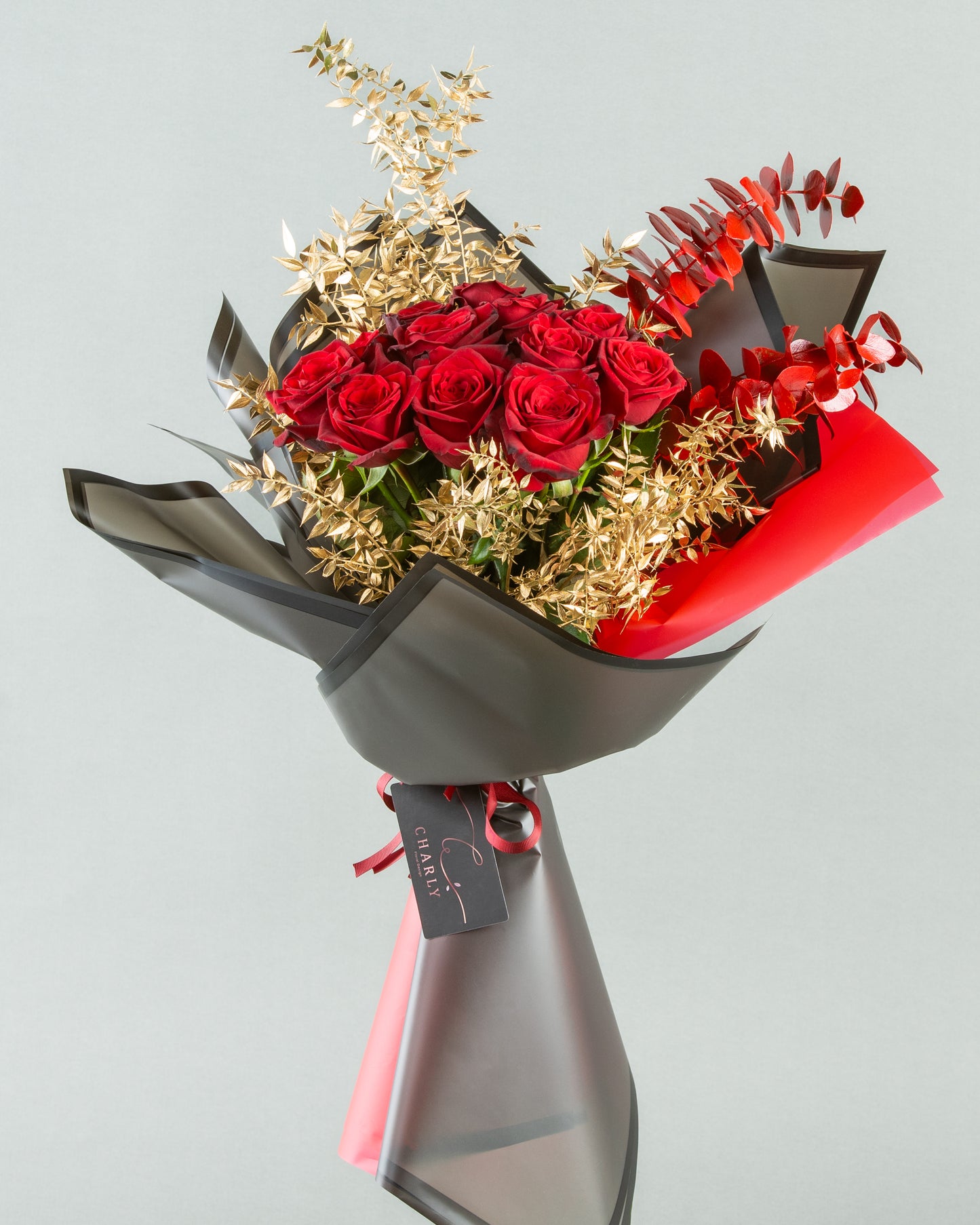 Crimson Elegance: 12 Red Roses with Painted Eucalyptus and Gold Italian Ruscus