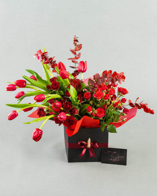 Crimson Elegance: Red Tulips and Baby Roses with Red Eucalyptus