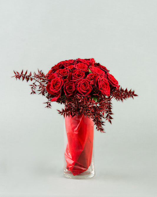 Crimson Elegance: 20 Red Roses with Bordo Ruscus in Vase