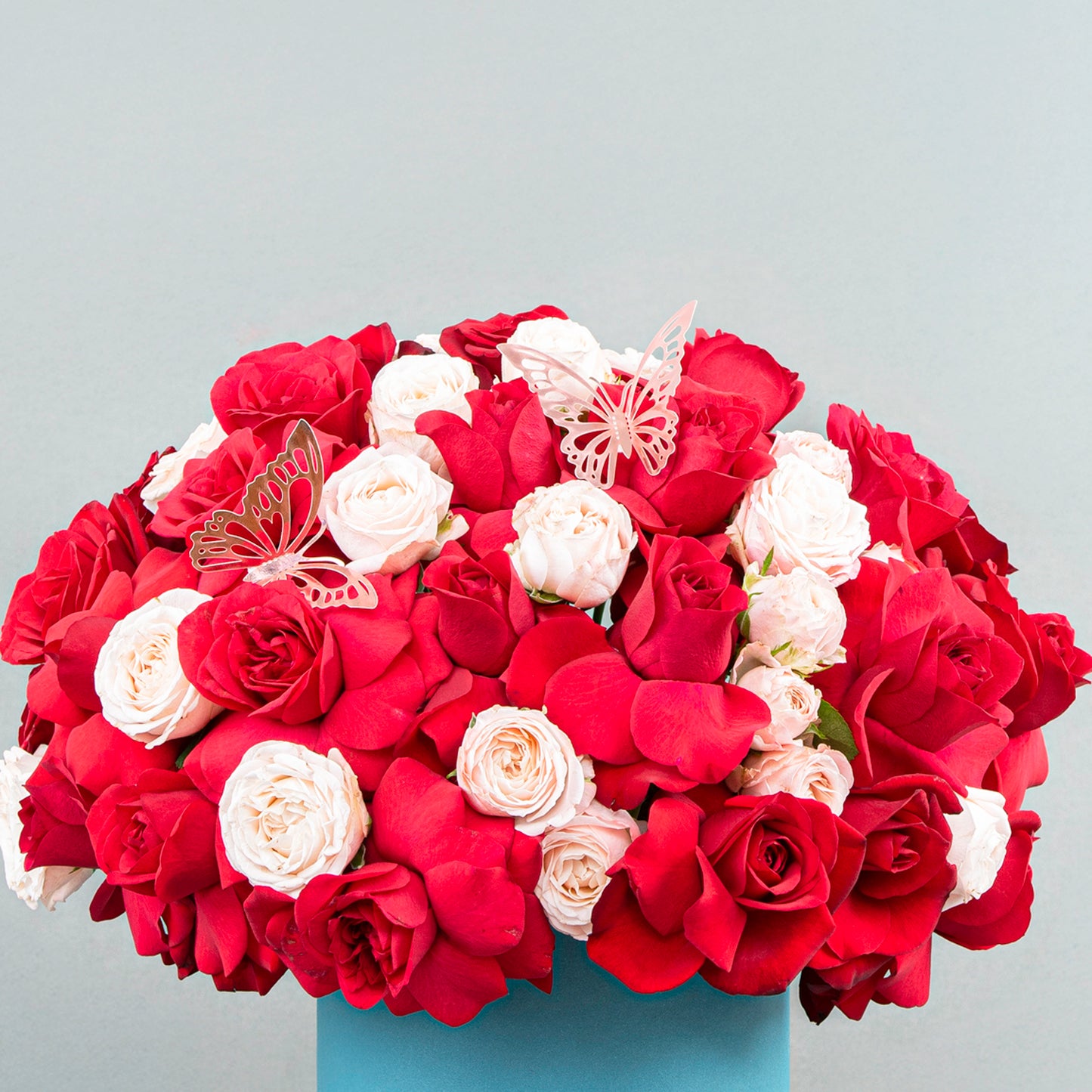 A Stunning Fusion of 20 Red Roses with Light Pink Body Roses in Petrol-Colored Box