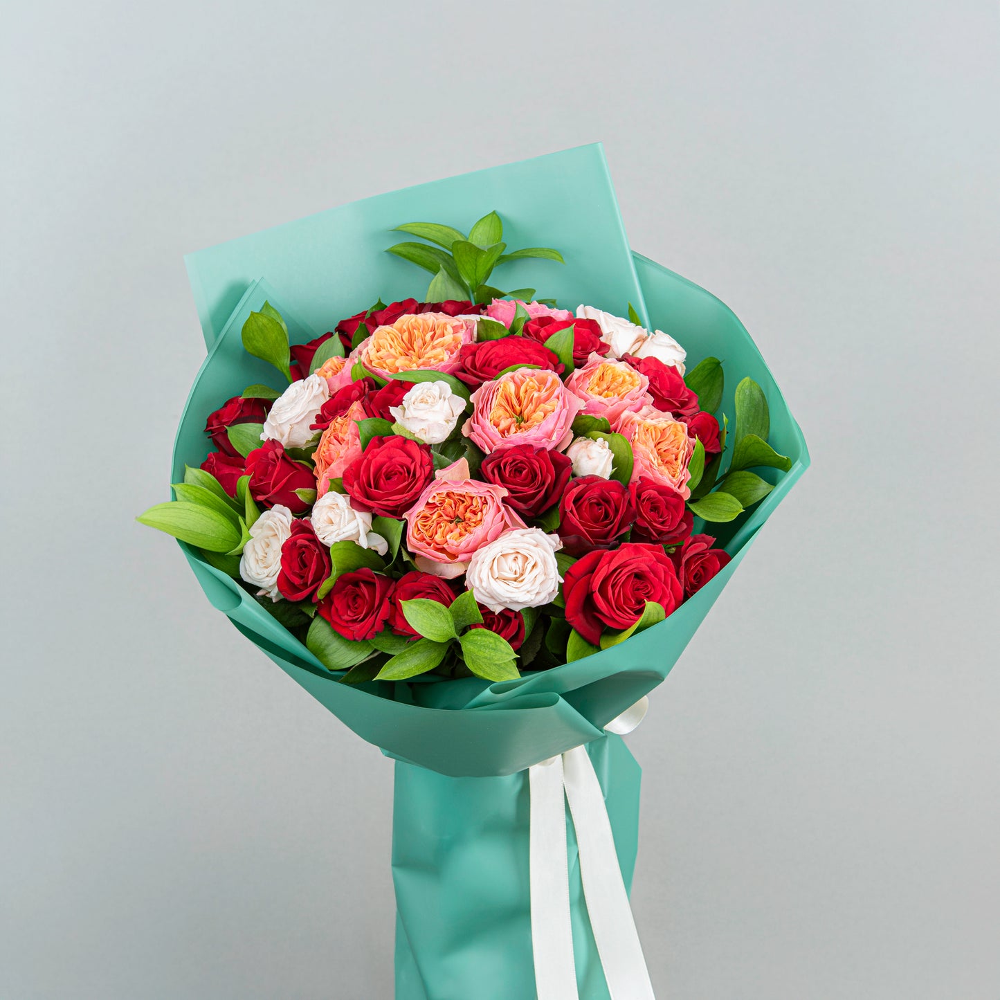 A Timeless and Elegant Bouquet made from Two Dozen Red Flowers with English Roses, Light Pink Bobby Roses, and Greenery