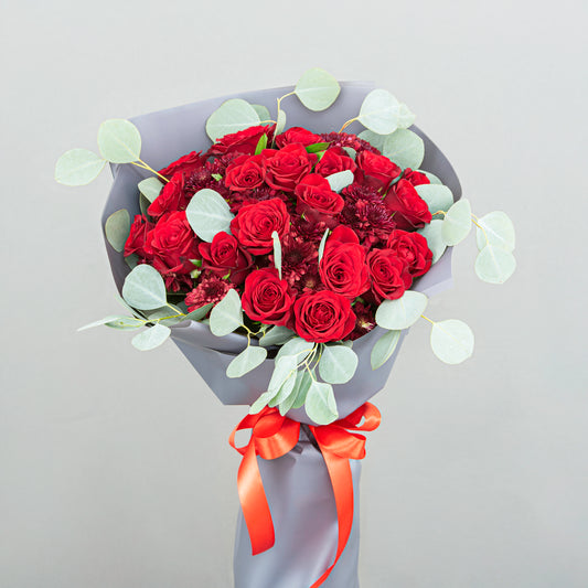 A Bold Bouquet Made From 20 Red Roses with Eucalyptus and Red Chrysanthemum