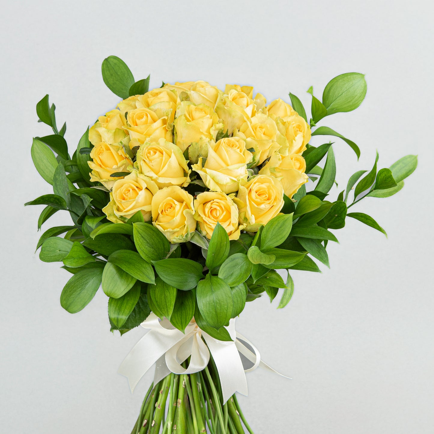 A Bright and Cheerful Bouquet Made From 20 Yellow Roses and Greenery