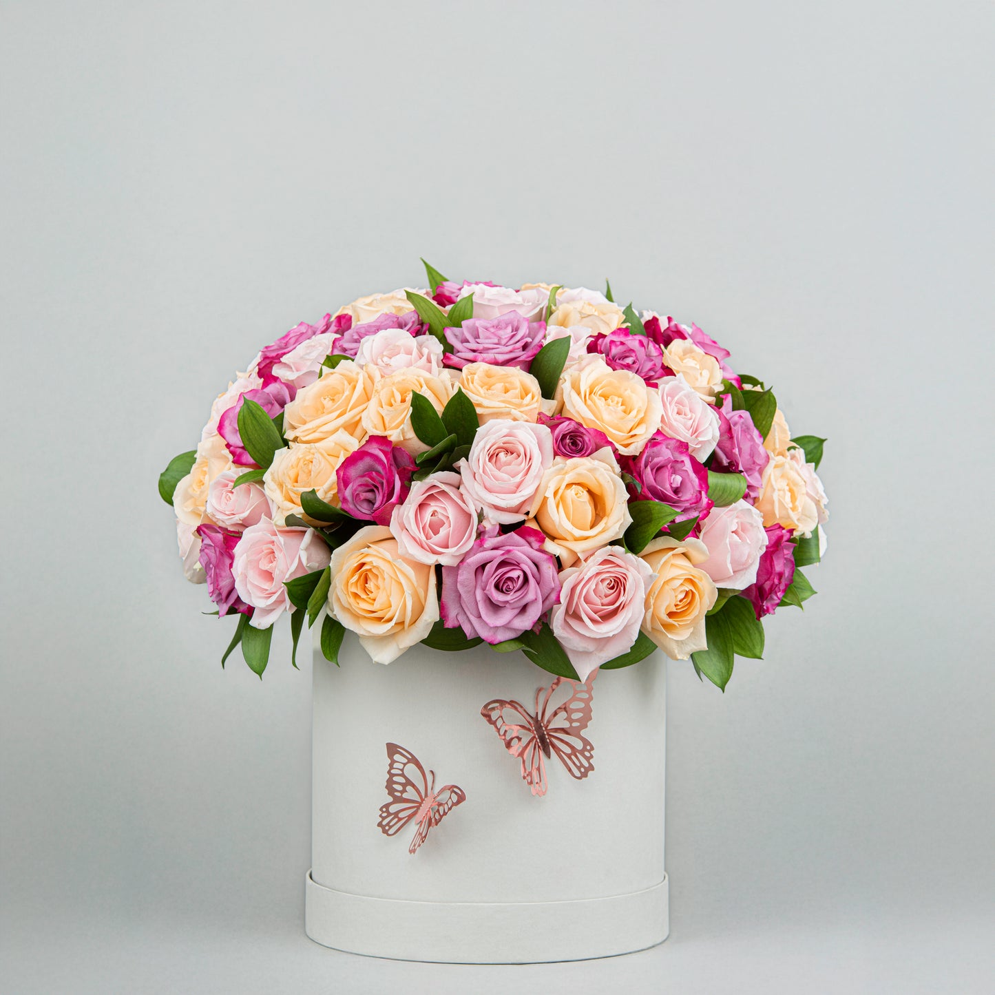 A Burst of Joy imade from 60 Colorful Blooms with Greenery in Elegant White Box