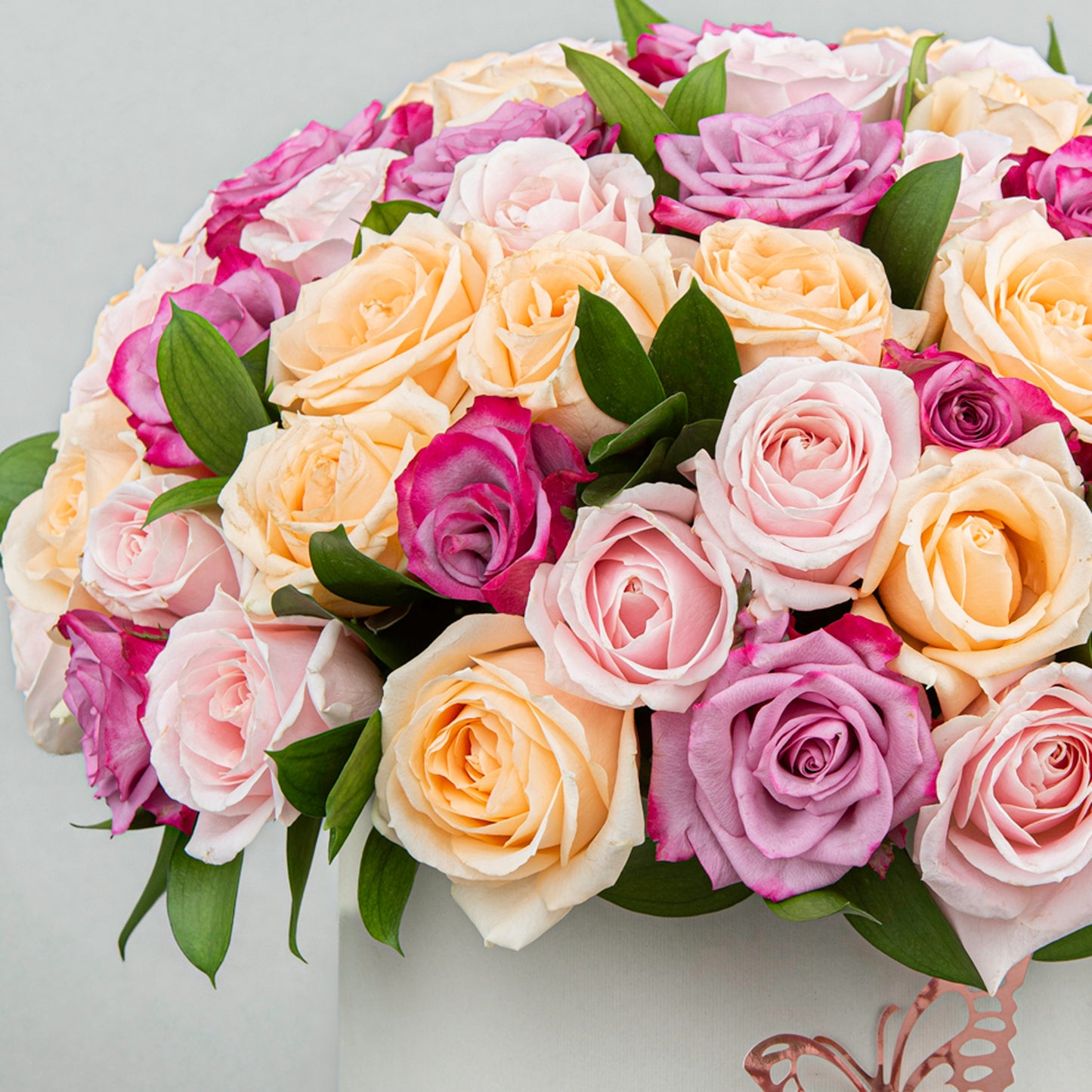 A Burst of Joy imade from 60 Colorful Blooms with Greenery in Elegant White Box