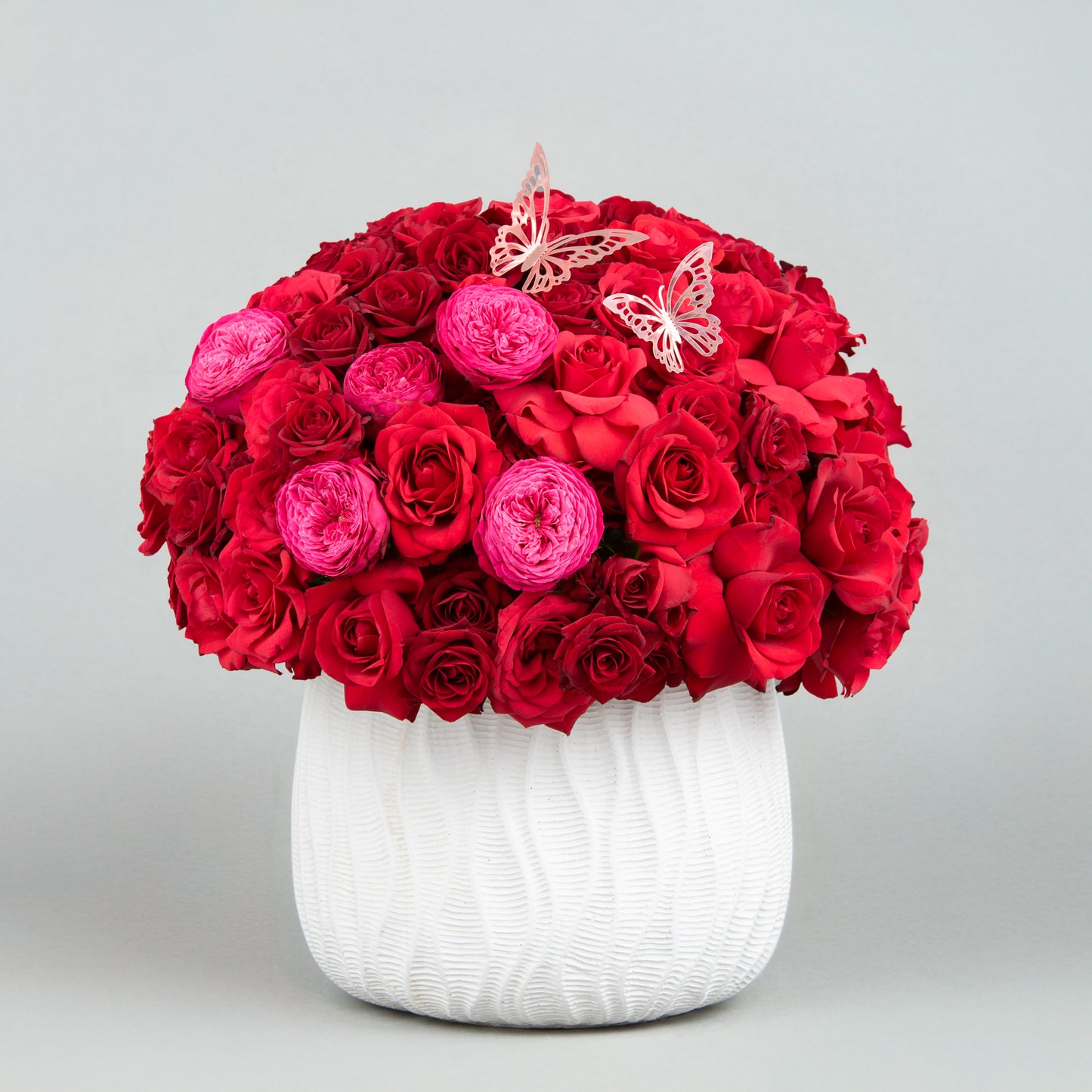 A Bold and Elegant Expression of Love made from 60 Red Roses with English Roses in Concrete Vase