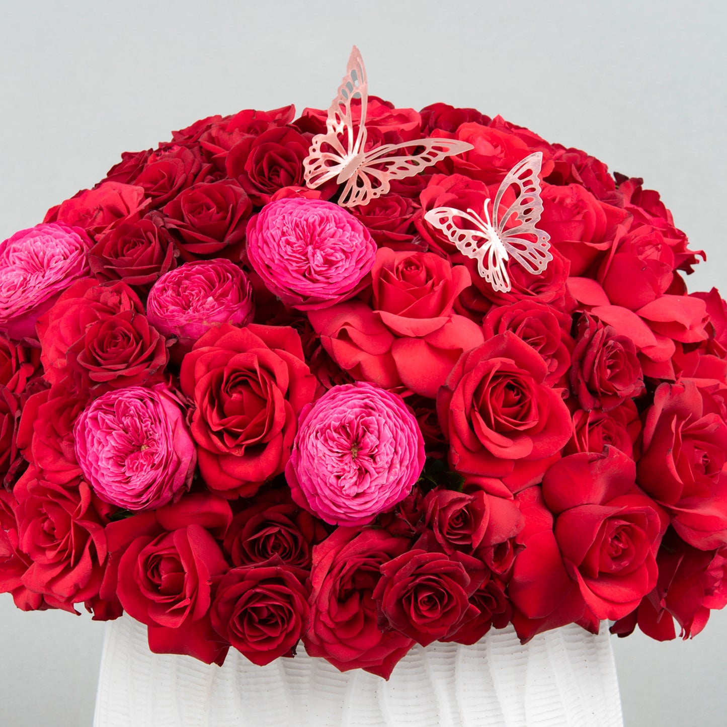 A Bold and Elegant Expression of Love made from 60 Red Roses with English Roses in Concrete Vase