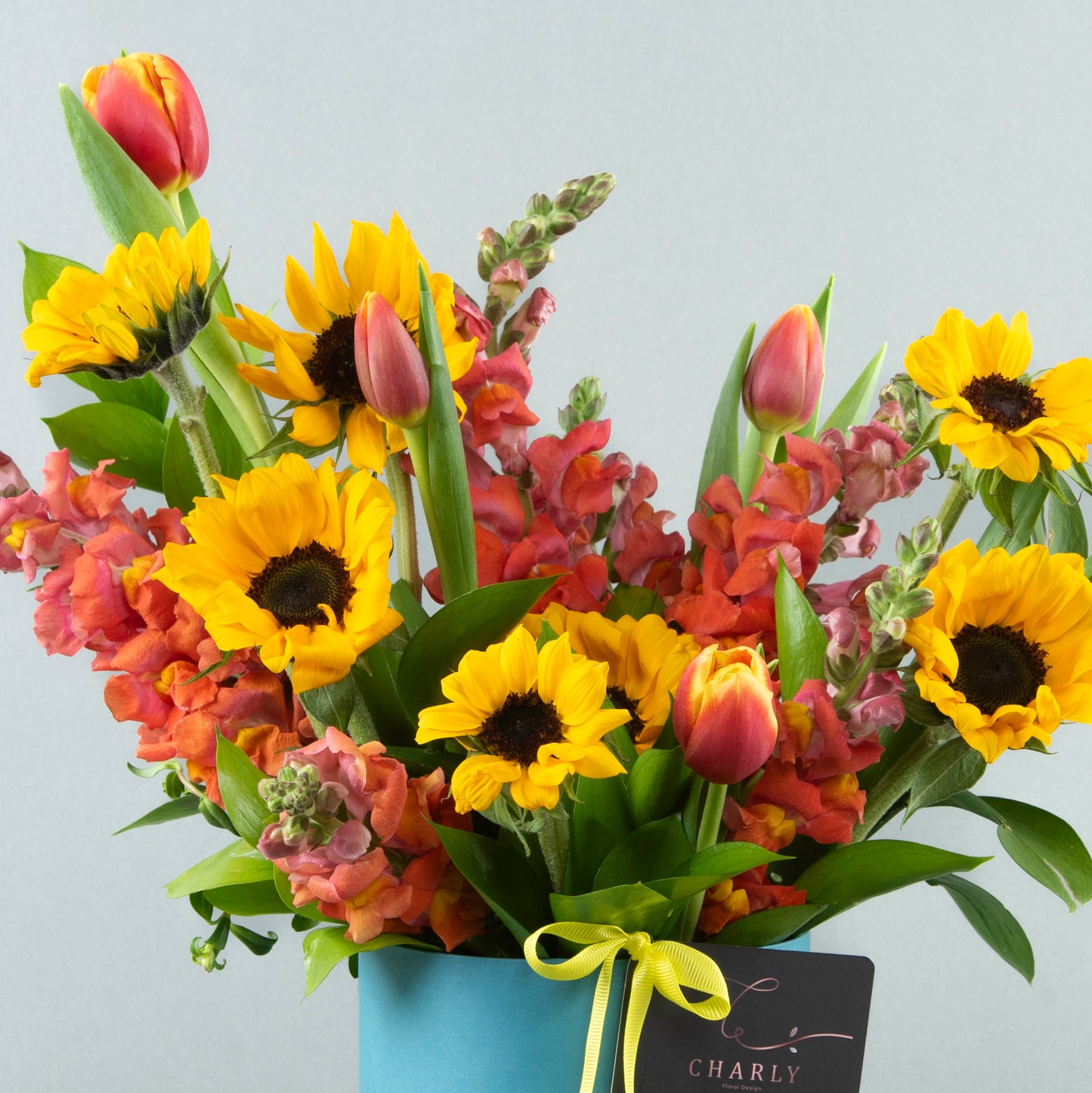 Sunset Glow: Orange Tulips & Sunflower Arrangement in Blue Box