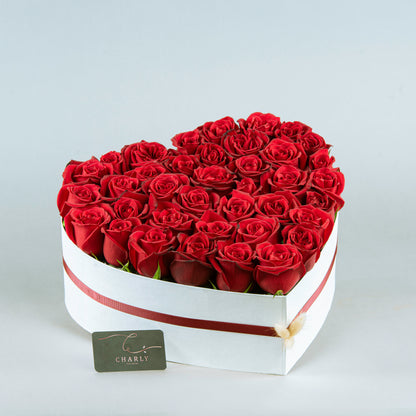 Crimson Heart Elegance: Red Roses in White Heart-Shaped Arrangement