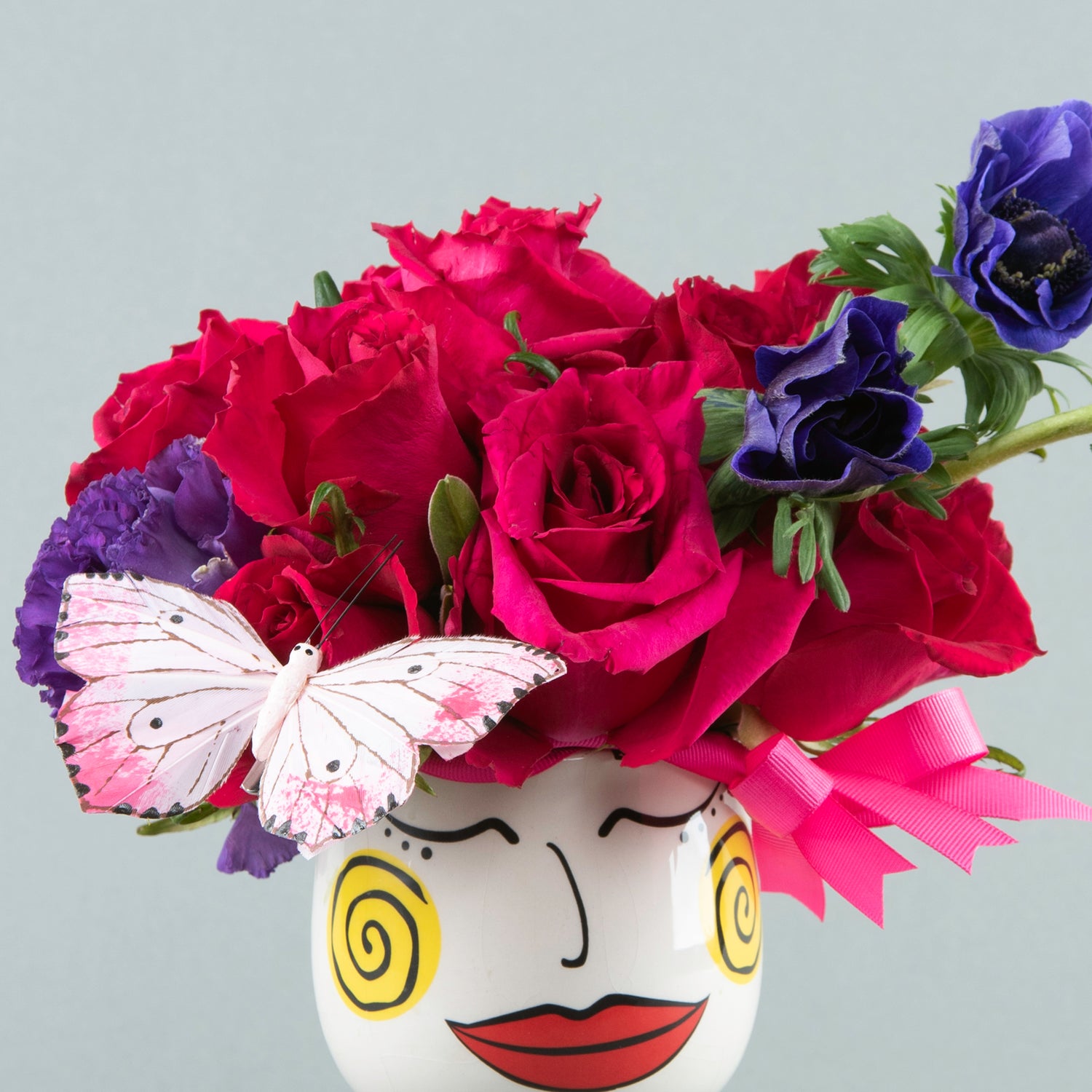 Modern Muse: Fuchsia Roses and Lilac Estoma in Face Vase