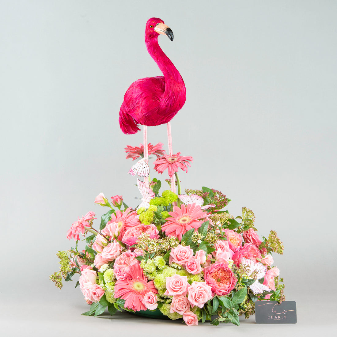 Flamingo Whimsy: Colorful Arrangement with Pink Hues and Feathers