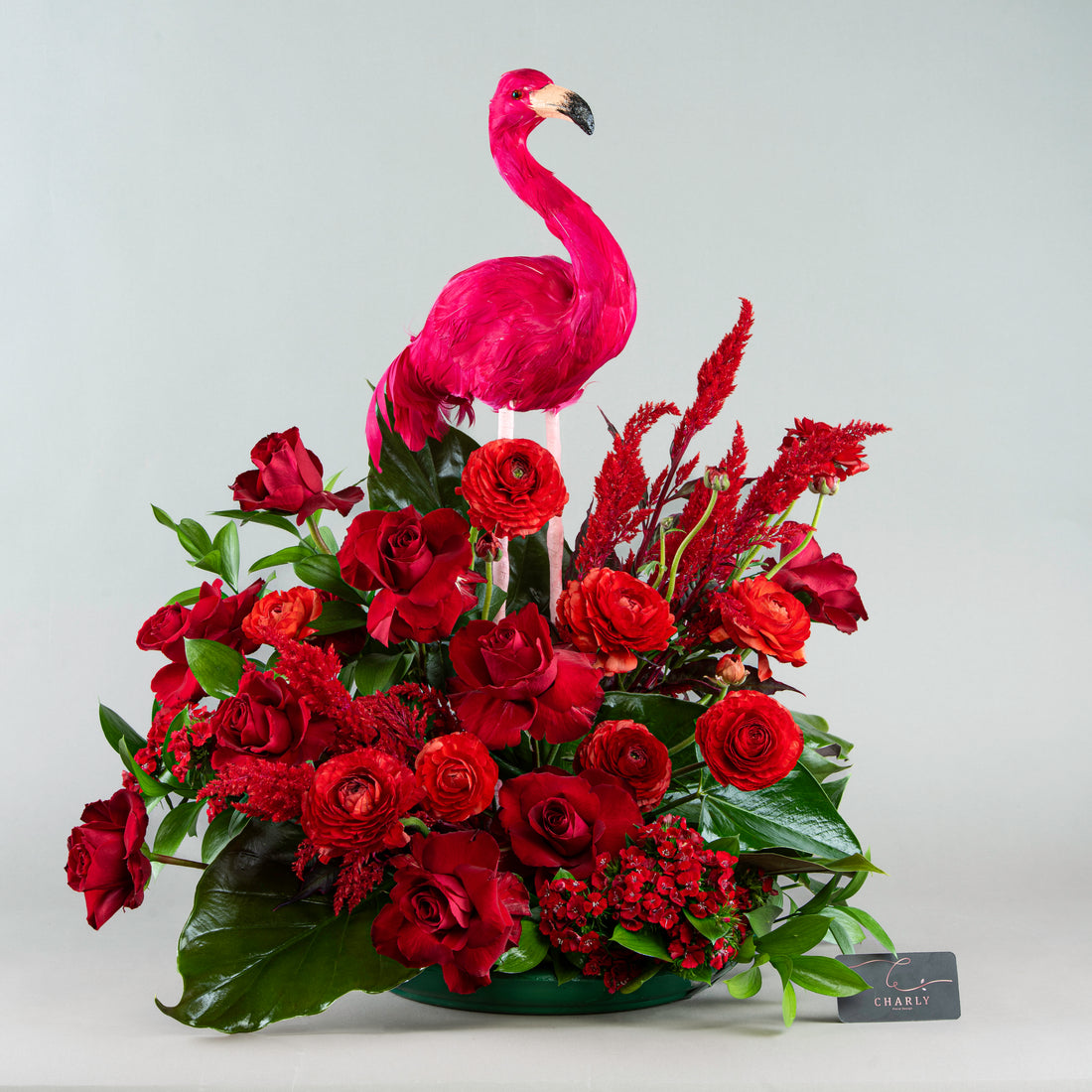 Flamingo Finesse: Exotic Red Arrangement with Roses and Feathers