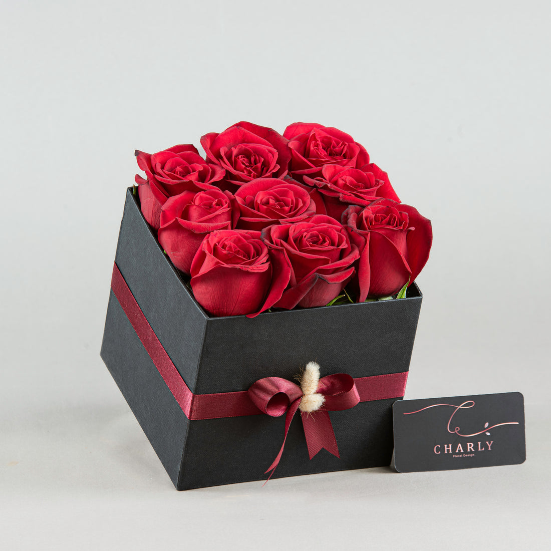 Elegant Noir: Red Roses in Black Square Box