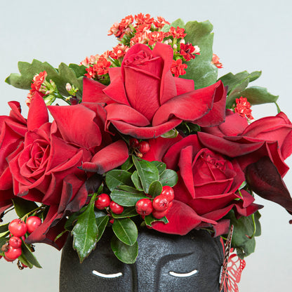 Enigmatic Beauty: Red Roses with Wild Berries in Black Face Pot