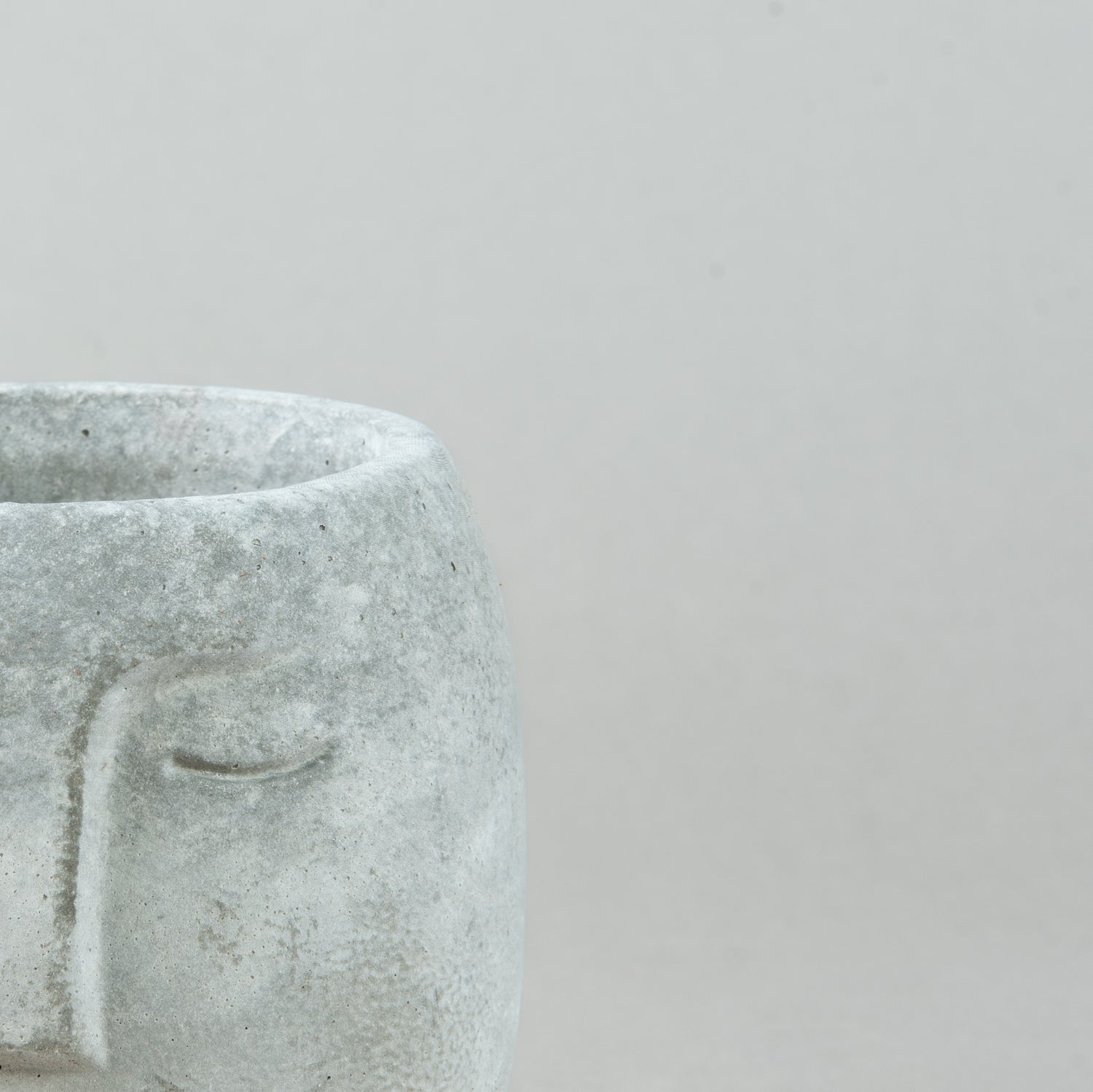 Contemporary Visage: Concrete Face Pot