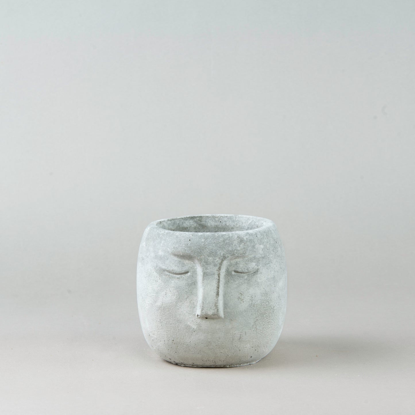 Contemporary Visage: Concrete Face Pot