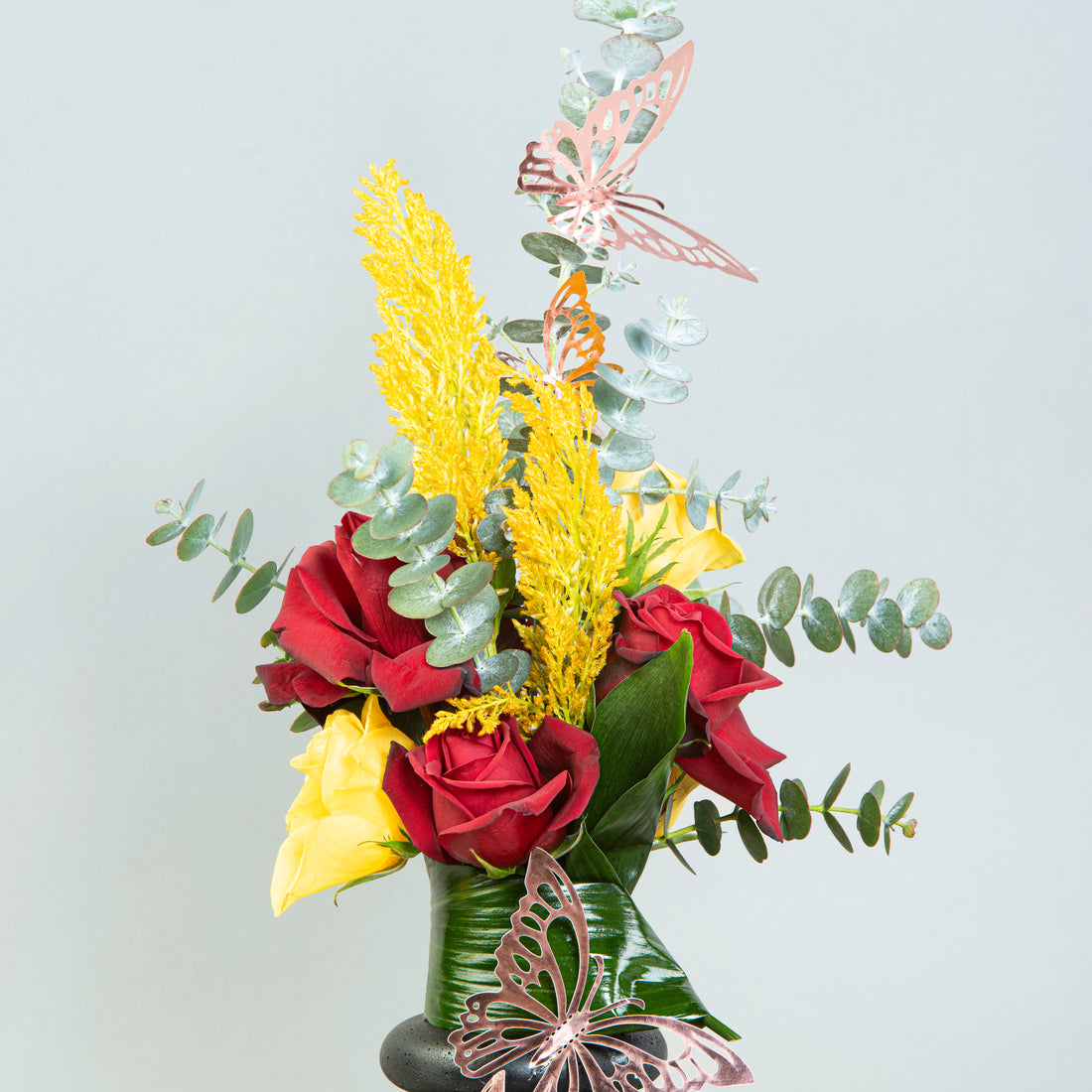 Triple Harmony: Roses and Eucalyptus in Three-Loop Vase