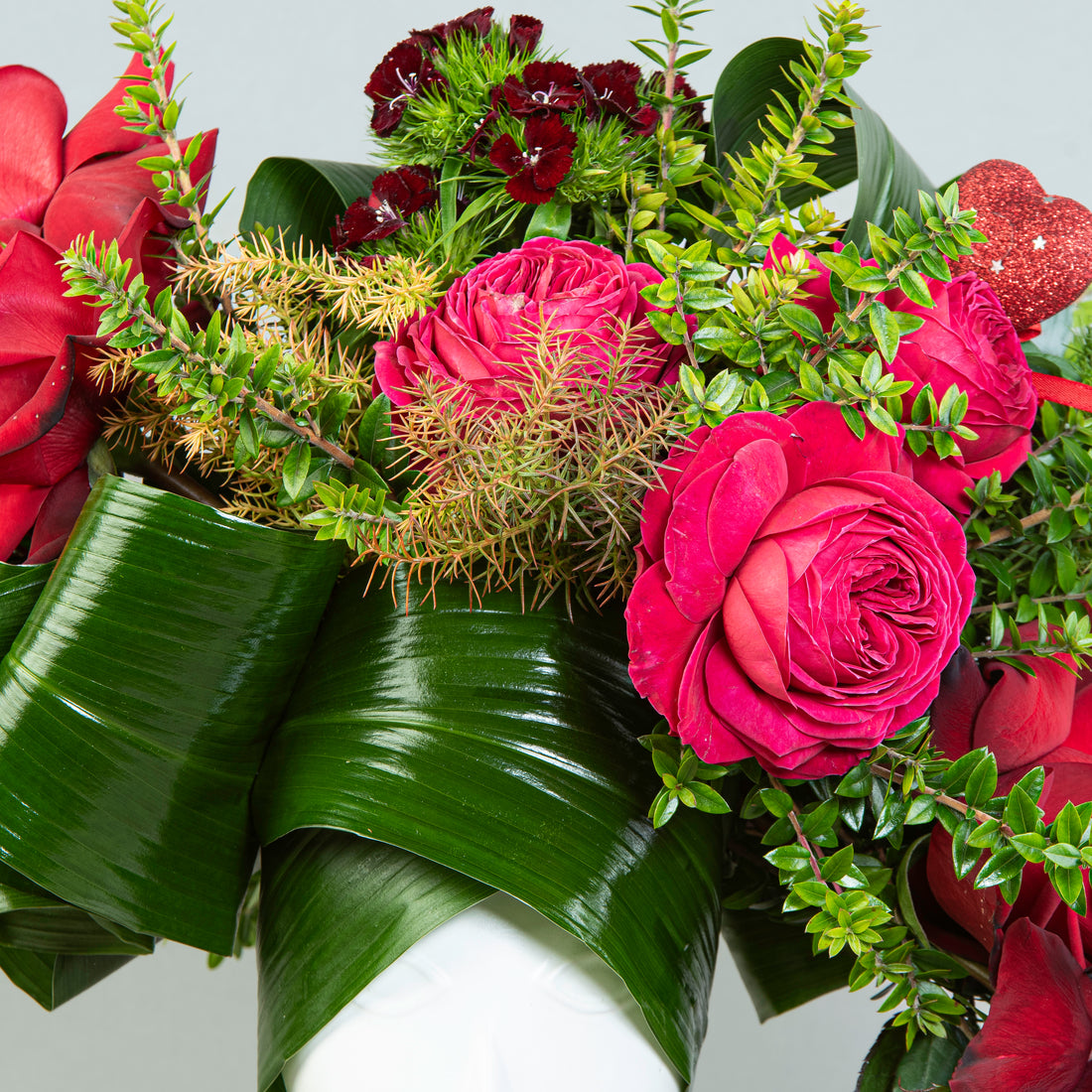 Ethereal Blossom Elegance: Roses and Aspidistra in Porcelain Face Vase