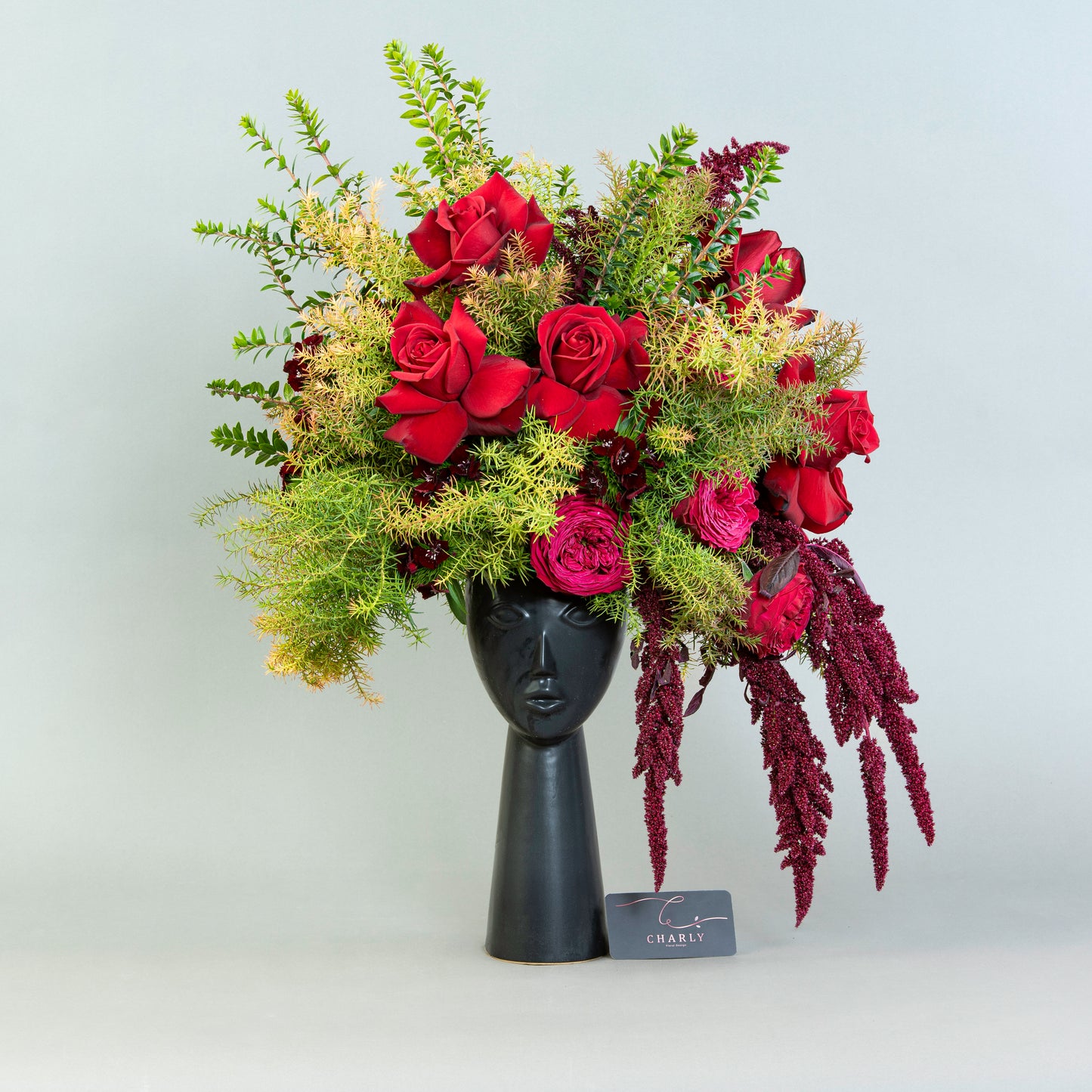 Mystic Floral Portrait: Red Roses and Amaranthus in Porcelain Face Vase