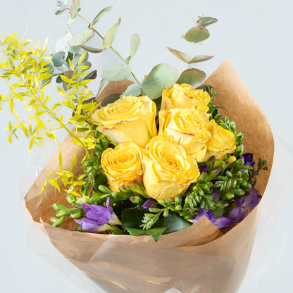 Sunshine and Lavender: Yellow Blooms and Purple Freesia Arrangement