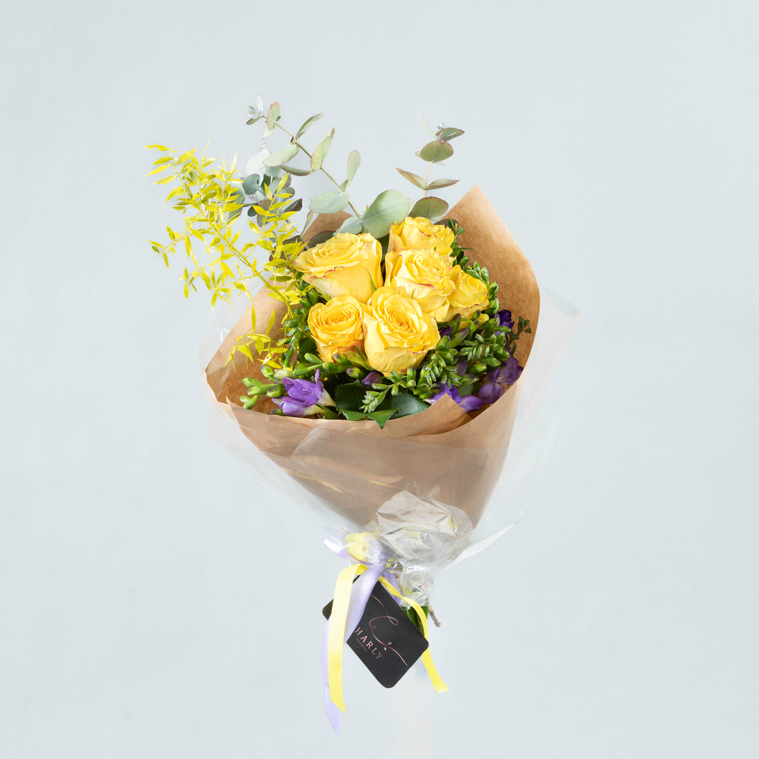 Sunshine and Lavender: Yellow Blooms and Purple Freesia Arrangement